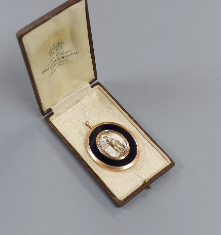 A Regency yellow metal, blue guilloche enamel and plaited hair mourning pendant, with inset ivory panel of a lady by an urn inscribed 'Rest in Peace', 56mm